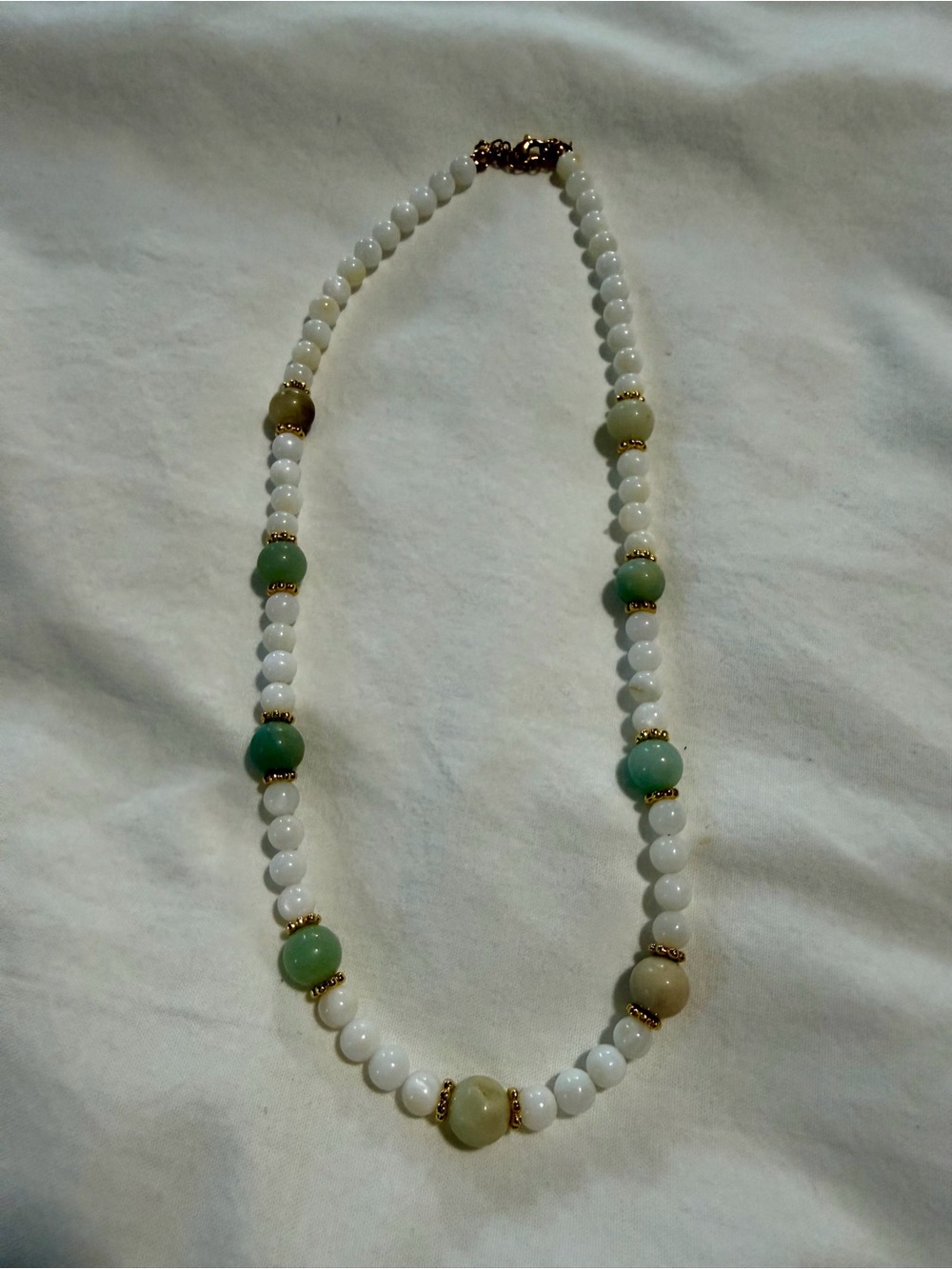 White and Green Beaded Necklace with Gold Accents